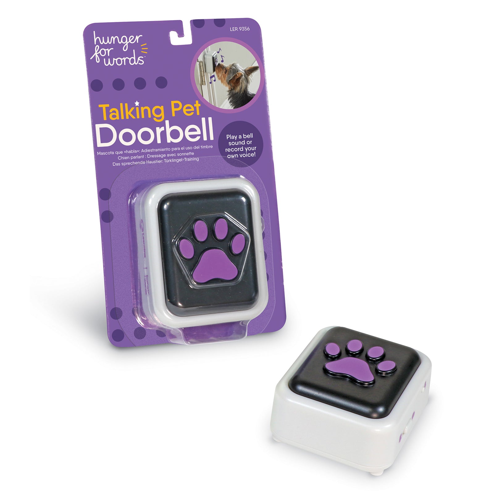 A black plastic pet doorbell with a pawprint on it, next to a package containing the same doorbell