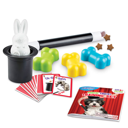 a Magic Trick Training Set for Dogs, showing the contents: a black top hat with rabbit inside, a magic wand, a set of magic trick cards, a training booklet and 3 colorful bone toys