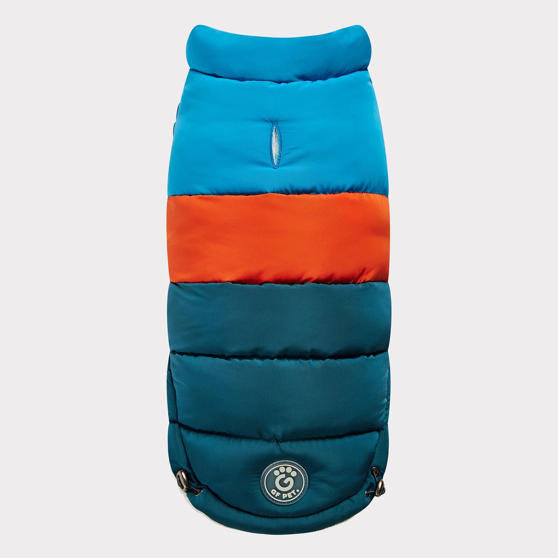 top view of a blue, orange and teal color blocked puffer jacket for dogs 