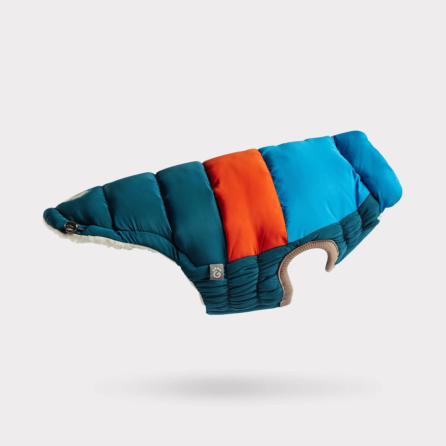 side view of a blue, orange and teal color blocked puffer jacket for dogs 