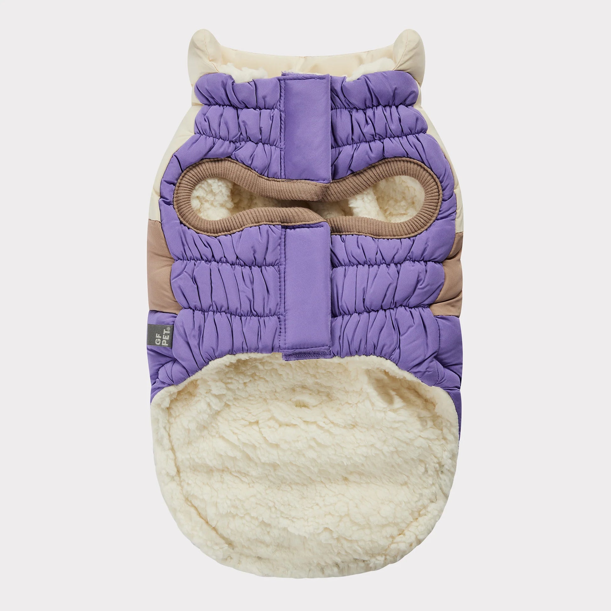 underside view of an ivory, beige and lavender color blocked puffer jacket for dogs 