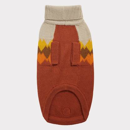 the underside of a beige and rust dog sweater with colorful mountain peaks graphic