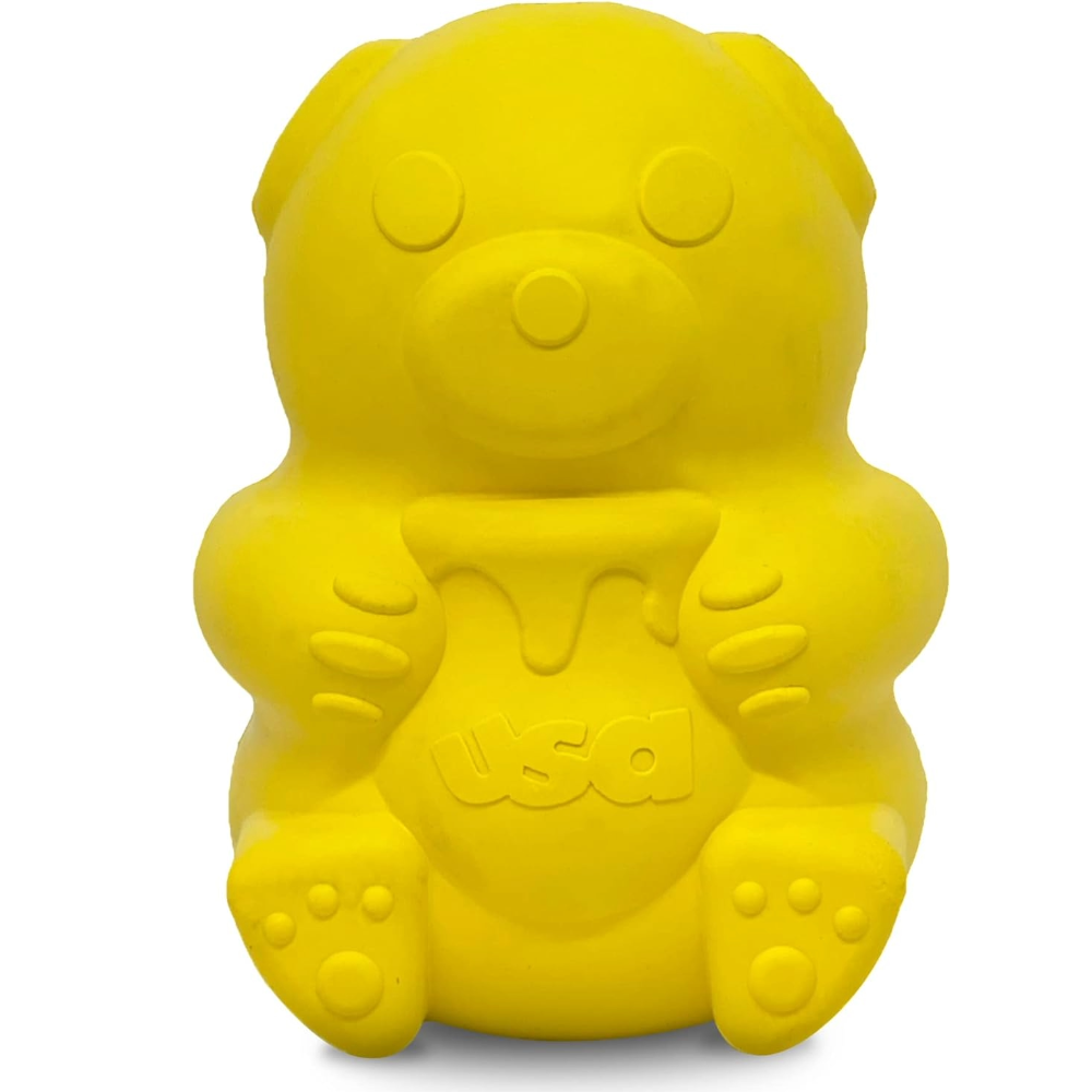 a yellow dog toy shaped like a bear with honey pot