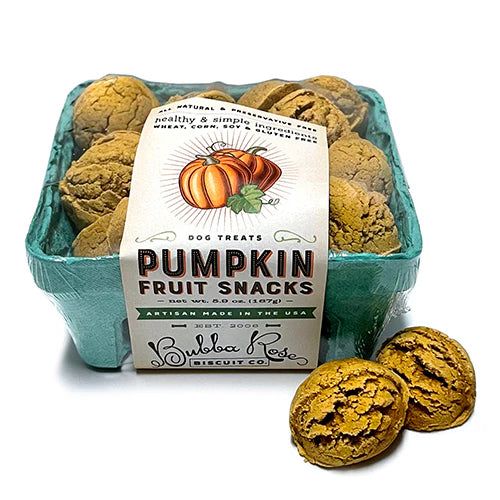 A green produce tub containing pumpkin dog treats