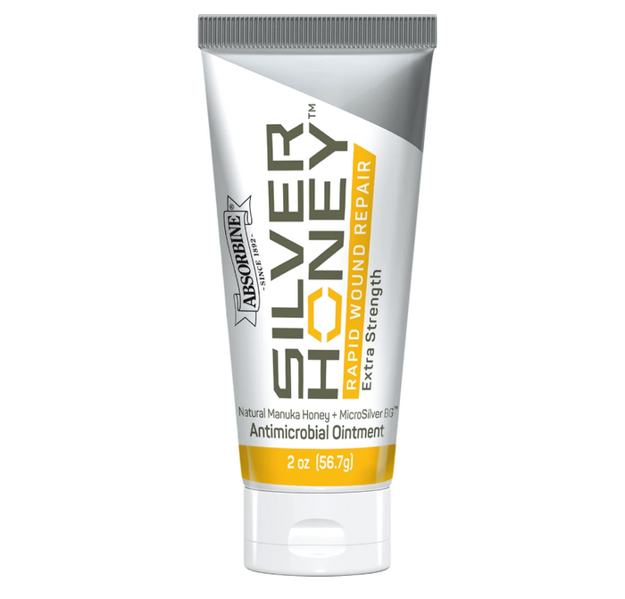 The front of a white and silver tube of Silver Honey rapid Wound Care Ointment 