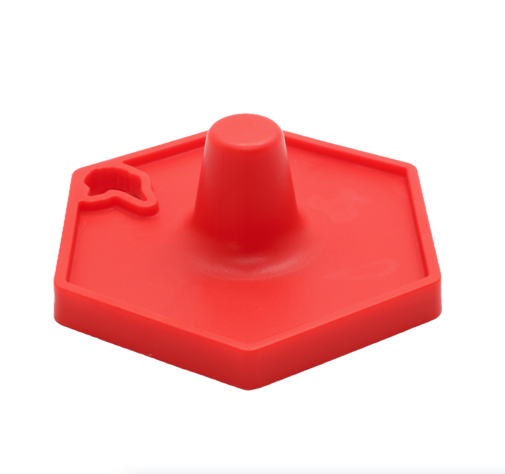 a red Stopple toy stand