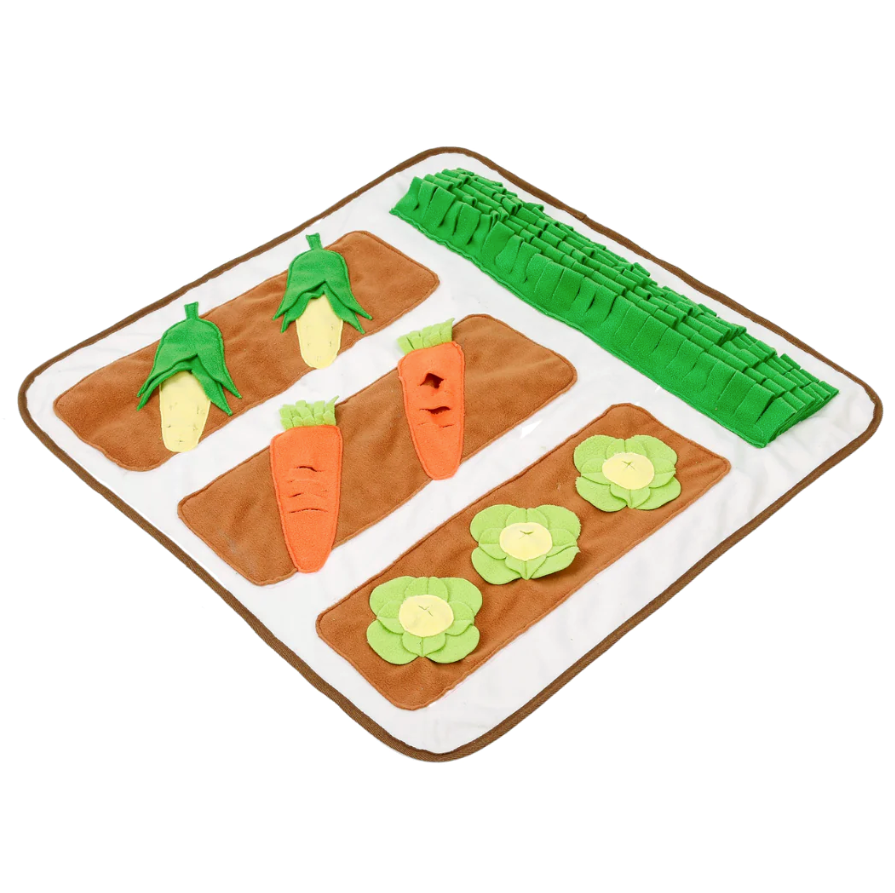A vegetable garden-themed snuffle mat dog toy with 3 cabbages, 2 ears of corn, 2 carrots and some grass