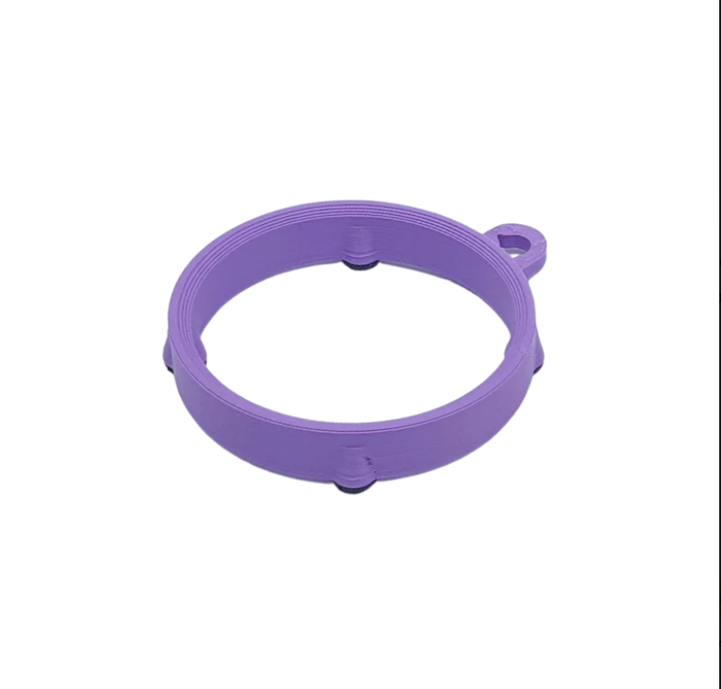 A lavender rubber ring-shaped stand for fillable work-to-eat dog toys