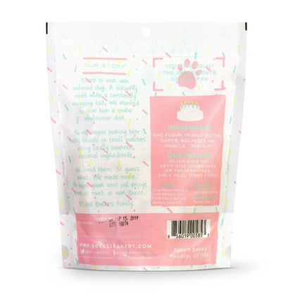 The white and pink back of a bag of dog biscuits