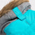 close up of the hood of an aqua and grey winter parka for dogs