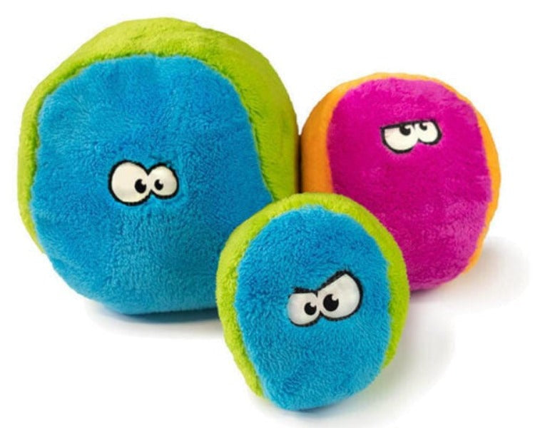 two blue and green and one orange and pink round plush dog toys with eyes