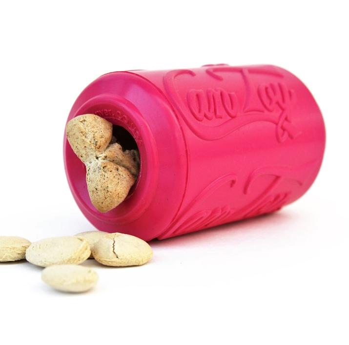 a hot pink soda can shaped dog toy lying on its side with treats inside