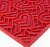 closeup shot of a red silicone lick mat with a heart pattern on it