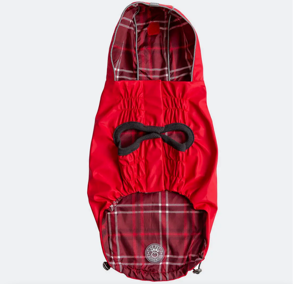 A red dog raincoat with red and white plaid tropical lining