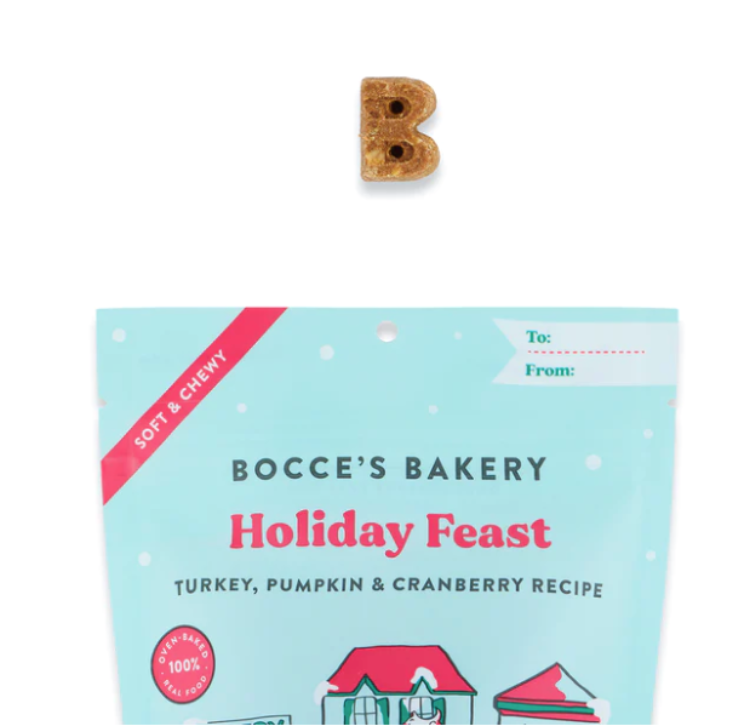 a bag of Holiday Feast dog Treats with one treat displayed