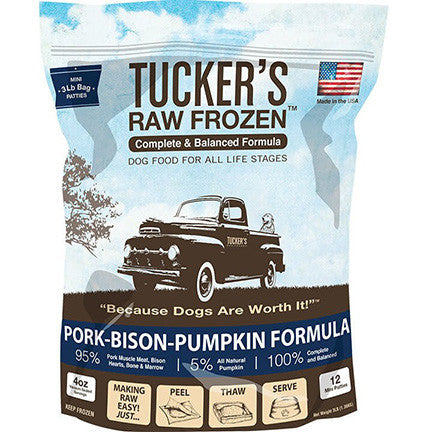 a brown and blue bag of frozen raw pork and bison dog food
