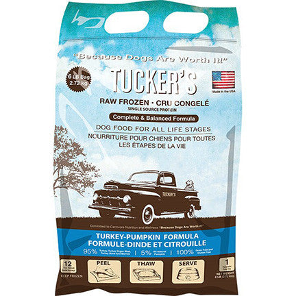 a brown and blue bag of frozen raw turkey dog food