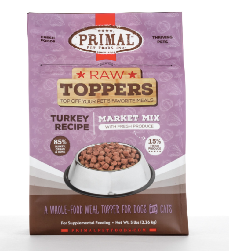 A purple and brown bag of frozen raw turkey dog food toppers