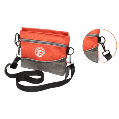 an orange and grey dog treat pouch with a black strap