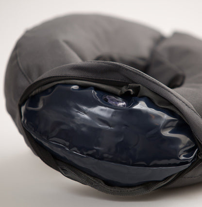 a grey inflatable recovery collar with the cover unzipped to show the inflatable insert